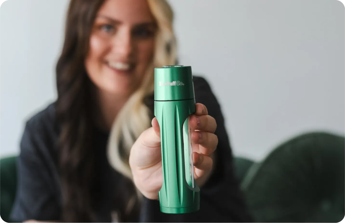 Customer holding a green ZenPuff
