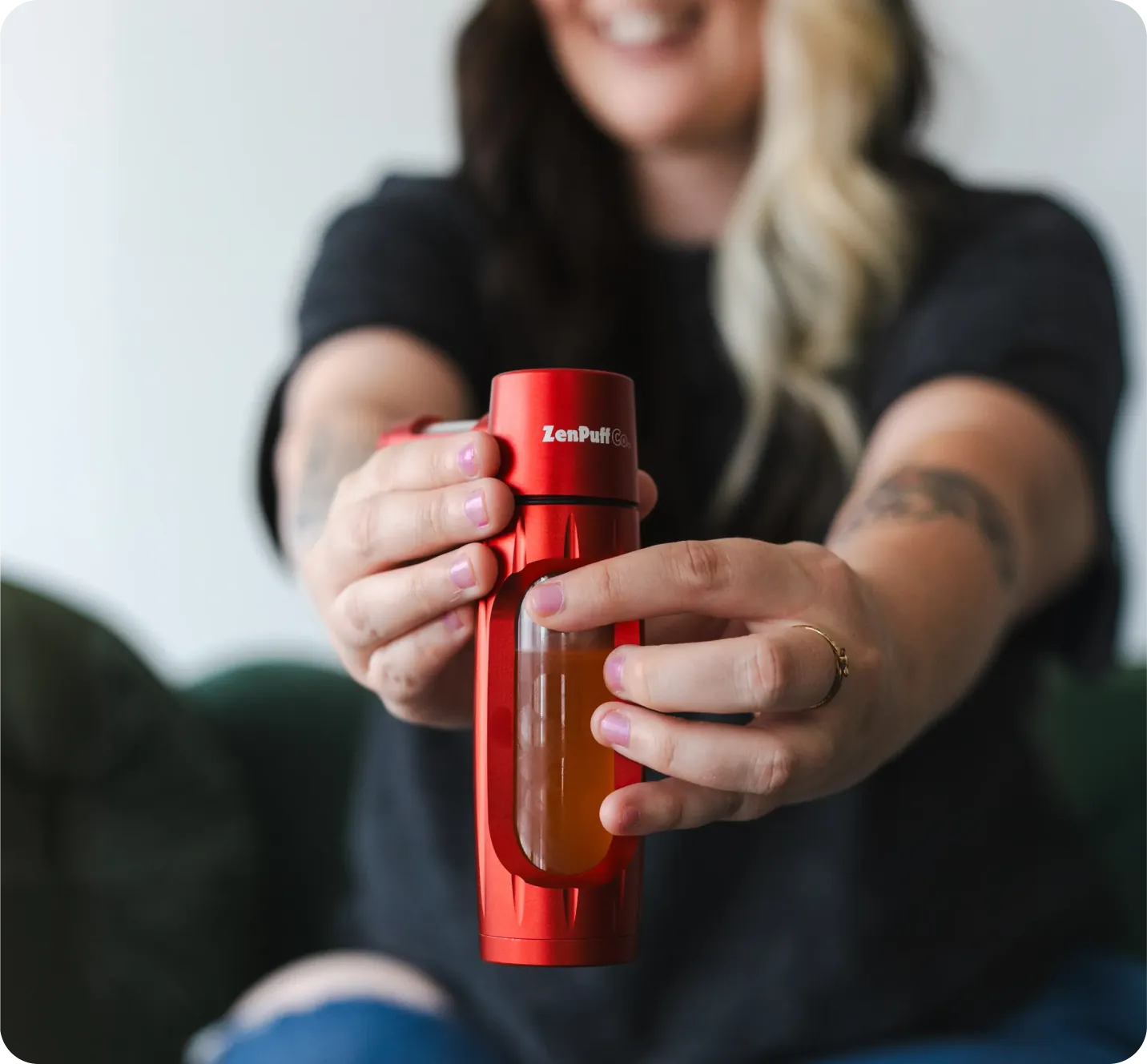 Customer holding a red ZenPuff
